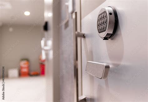 Numeric keypad and handle of a large safe door Stock Photo | Adobe Stock