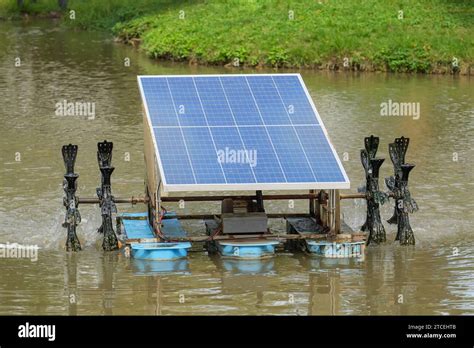 Solar Cell Panel Paddle Wheel Aerator In City Park Pond Stock Photo Alamy