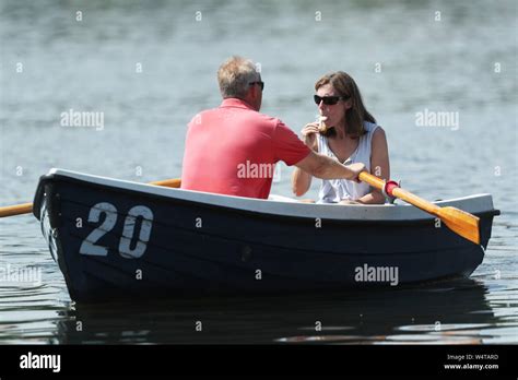 People Enjoy The Hot Weather While Boating In Hyde Park London As The UK Could Encounter The