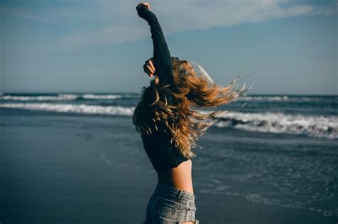 Free Photo Young Beautiful Girl Posing On The Beach Ocean Waves