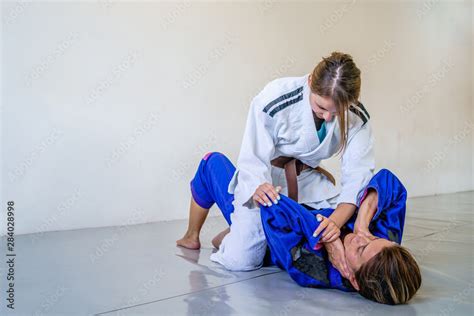 Two Brazilian Jiu Jitsu Bjj Women Female Athletes Fighting In Training Sparring Mount Position