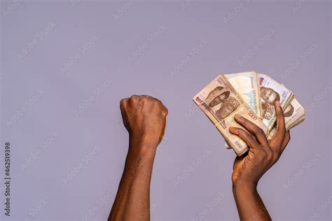 Black Hands Holding Money