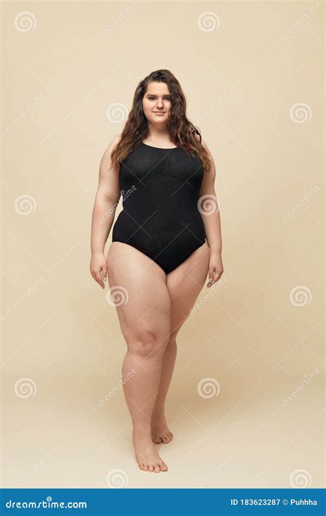 Plus Size Model Fat Woman In Black Bodysuit Full Length Portrait Brunette Standing And Looking