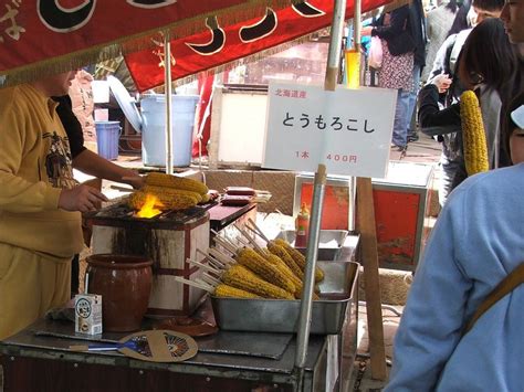 Tomorokoshi Corn Grilled With Miso Butter And Soy Sauce On A Stick