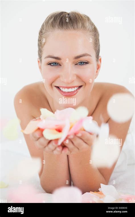 Pretty Blonde Lying On Massage Table Holding Petals Stock Photo Alamy