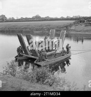 A Universal Carrier of the 53rd Anti-Tank Regiment is ferried across a