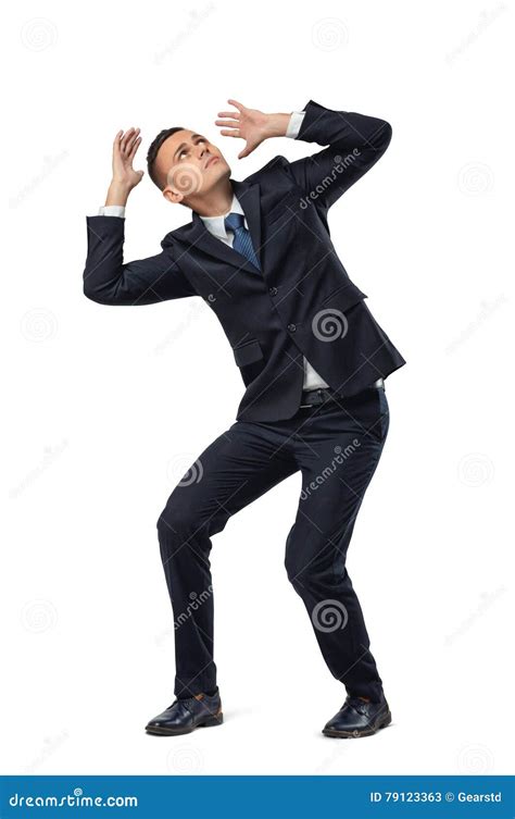 young businessman  defensive pose afraid   isolated