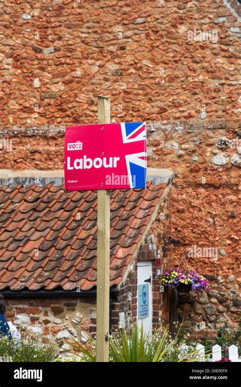 A Labour Party Sign Reading Vote Labour Outside A Cottage On The North