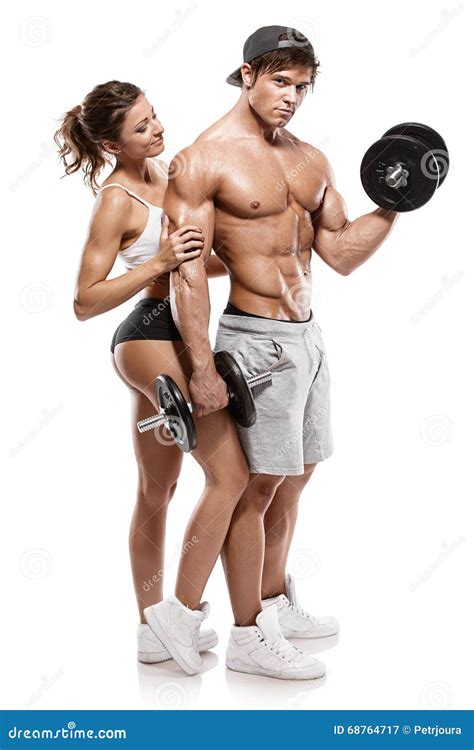 Muscular Bodybuilder With Woman Doing Exercises With Dumbbells Stock