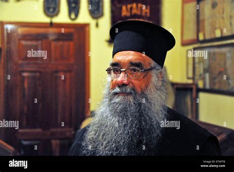 Greek Orthodox Priest In His Church In Plomari Lesvos Due To The