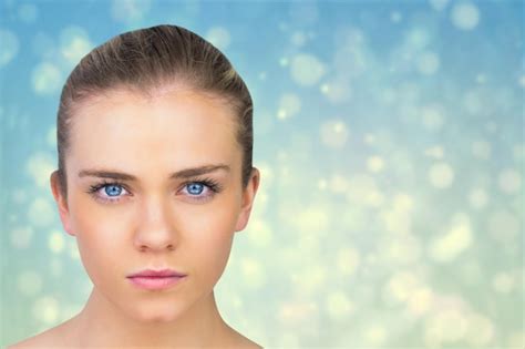 Premium Photo Serious Blonde Natural Beauty Against Blue Abstract