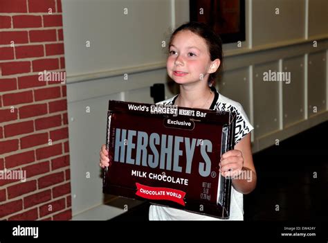 Hershey, PA: An adorable little girl holds up one of Hershey's world's ...