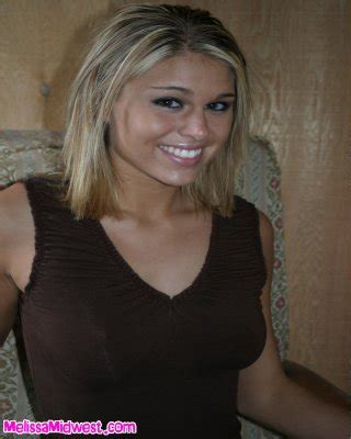 Melissa Midwest Posing On The Couch With A Brown Shirt On Porn Pictures XXX Photos Sex Images