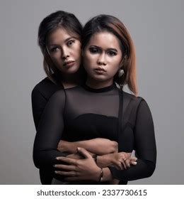 Studio Shot Photo Filipino Lesbian HugsのAI生成画像 Shutterstock