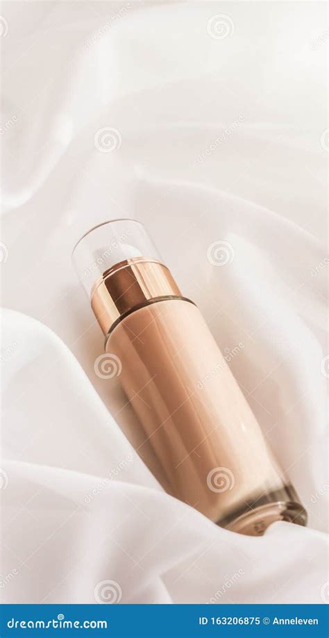 Tonal Bb Cream Bottle Make Up Fluid Foundation Base For Nude Skin Color On Silk Background