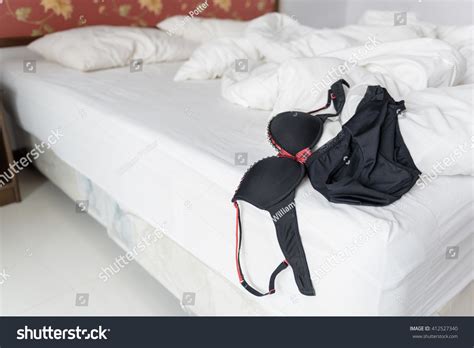 Woman S Black Lingerie Put On An Unmade Bed In A Hotel Room After