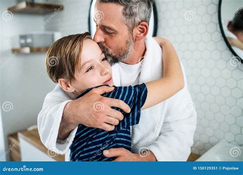 Mature Father With Small Son In The Bathroom In The Morning Kissing Stock Image Image Of