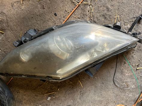 LAMPA PRZEDNIA LEWA REFLEKTOR LEWY PRZÓD RENAULT LAGUNA COUPE III XENON