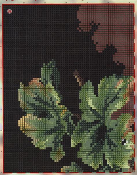 A Cross Stitch Pattern Of Leaves On A Black Background