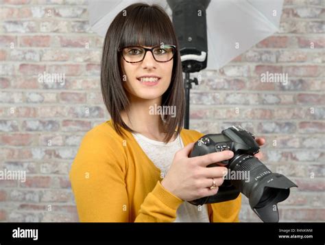 Attractive Brunette Woman With Photo Camera Stock Photo Alamy