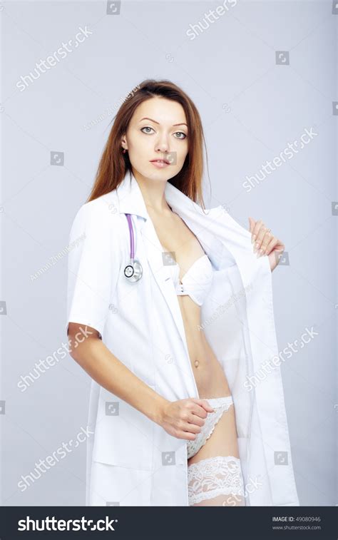 Sexy Female Doctor Revealing Medical Uniform With Stethoscope Stock