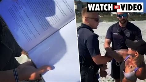 Woman Handcuffed For Wearing G String Bikini On Beach Photo