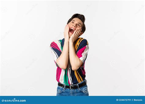 Image Of Excited Gay Man Shouting Of Joy And Looking Up Feeling Ecstatic Standing Against