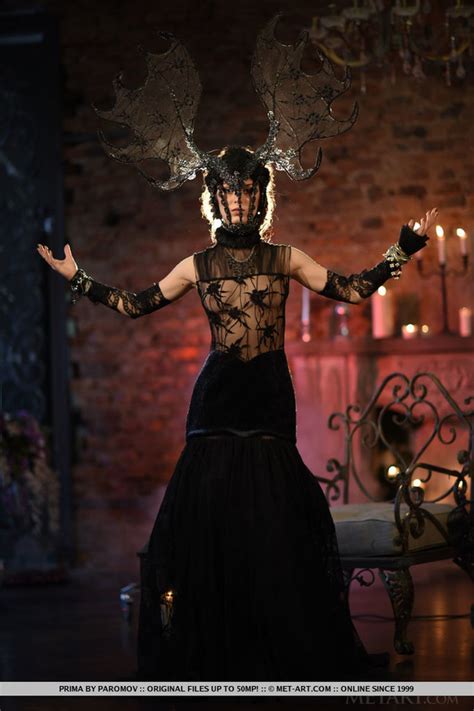 Sizzling Hot Brunette Sits On A Gray And Bl XXX Dessert Picture