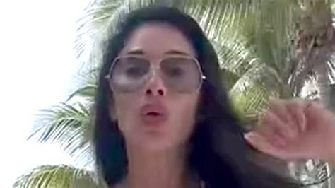 Nicole Scherzinger Struggles To Contain Her Assets In A Skimpy White Bikini As She Performs