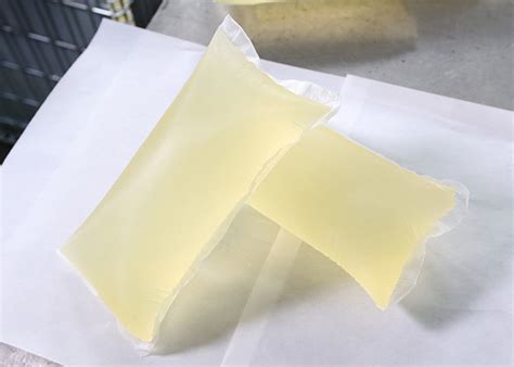 Hot Melt Adhesive For Core Integrity Fixation Side Tape And Construction