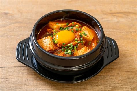 Premium Photo Kimchi Jjigae Or Kimchi Soup With Tofu And Egg Or