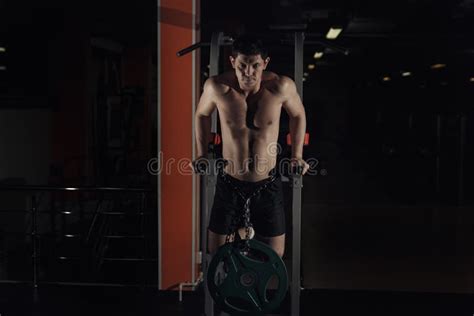 Muscular Bodybuilder Working Out In Gym Doing Exercises On Parallel Bars Athlitic Male Naked