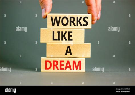 Works like a dream symbol. Concept words Works like a dream on wooden ...