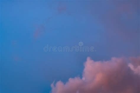 Pink And Orange Clouds On A Dark Twilight Blue Sky Stock Photo Image