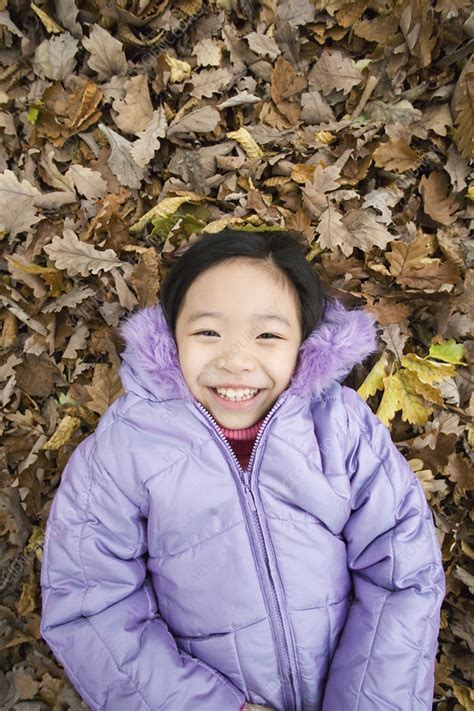 Smiling Girl Lying On Autumn Leaves Stock Image F001 1818 Science