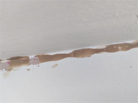 How to remove this solid, plastic like, adhesive? : r/DIYUK