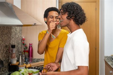 Premium Photo Romantic Gay Man Feeding His Couple In The Kitchen