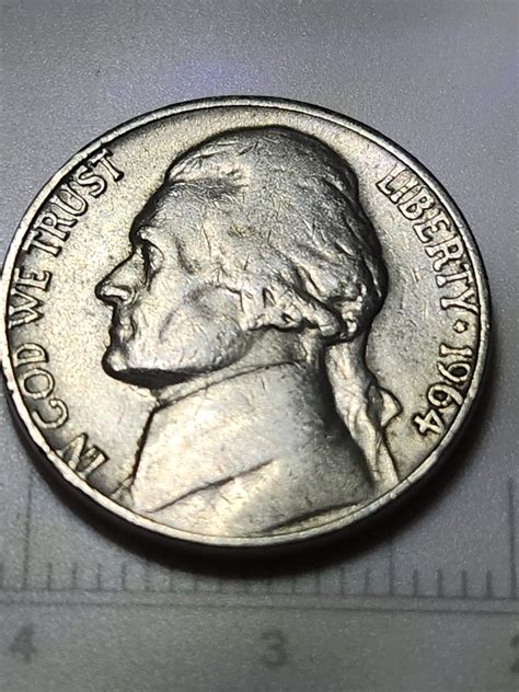 1964 Jefferson Nickel No Mint Mark. Die Chip Error on Rim on Reverse