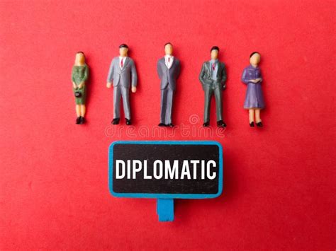 Miniature People And Wooden Board With The Word Diplomatic Stock Image