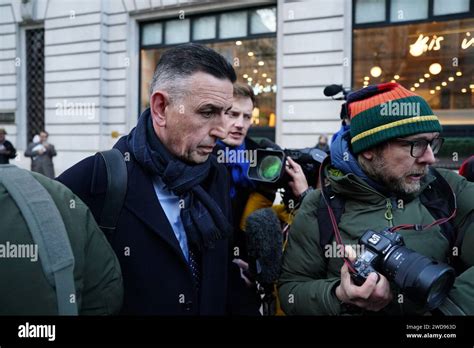 Fujitsu's European boss Paul Patterson (right) is surrounded by media ...