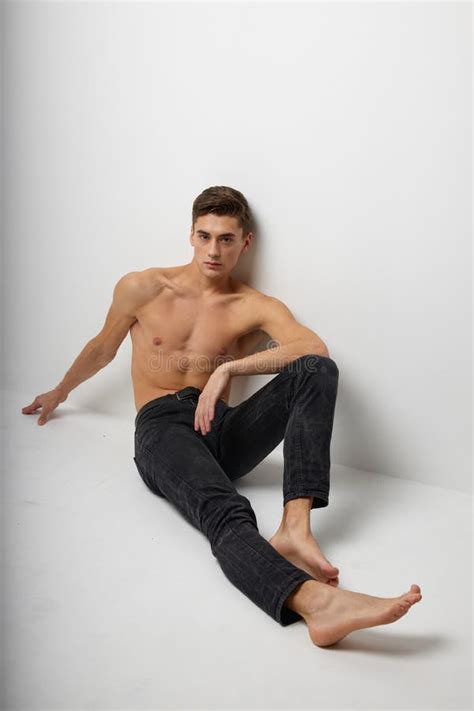 Man Sits On The Floor In Black Trousers Nude Torso Posing Luxury Model Stock Image Image Of