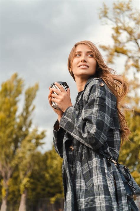 Confident Blonde Woman Enjoys Her To Go Coffee Outdoor On Cloudy Weather Stock Image Image Of