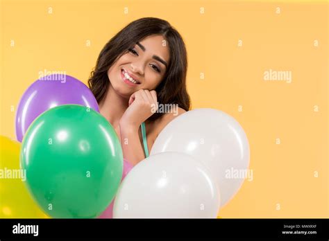 Happy Girl Posing In Bikini With Colorful Balloons Isolated On Yellow