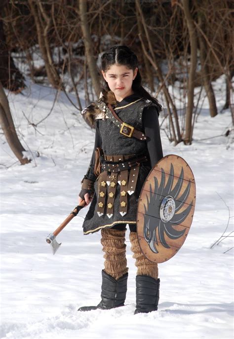 I made my little girl a shieldmaiden costume from wood, brass, leather
