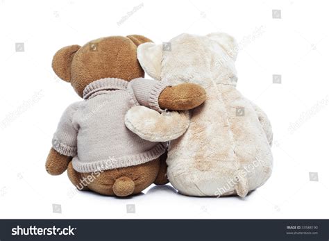 Back View Of Two Teddy Bears Hugging Each Other Over White Stock Photo