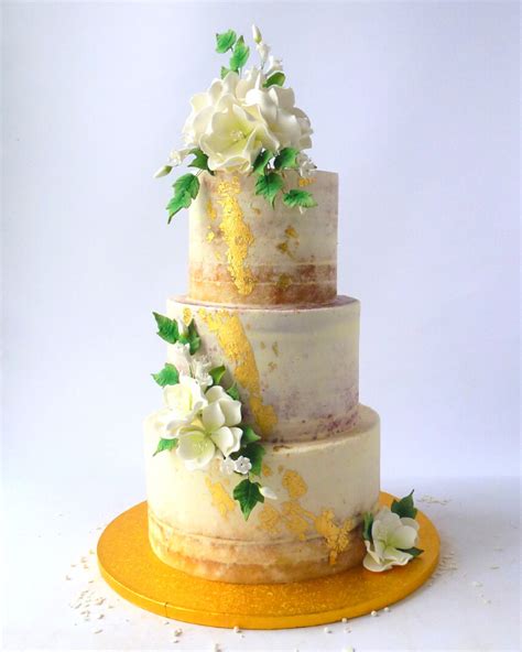 Semi Naked Wedding Cake With Sugar Flowers And Gold Or Silver Leaf