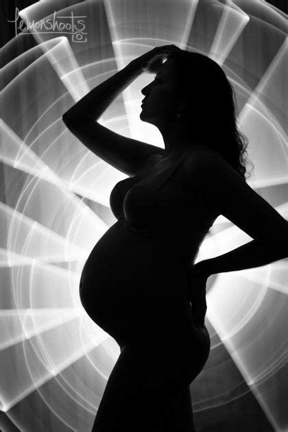 Silhouette Of Pregnant Mama Using Light Painting Light Painting