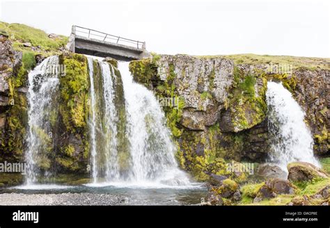 Kirkjufellsfoss Waterfall Near The Kirkjufell Mountain On The North