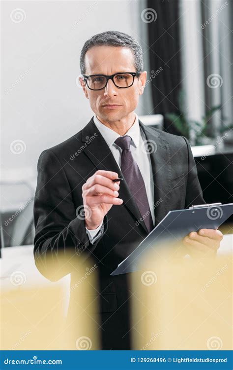 Portrait Of Focused Businessman With Notepad Stock Photo Image Of