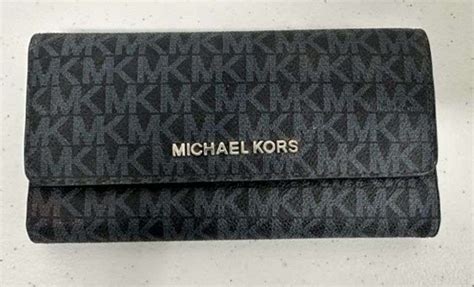 2) Michael Kors Wallets - Prime Time Auctions, Inc.